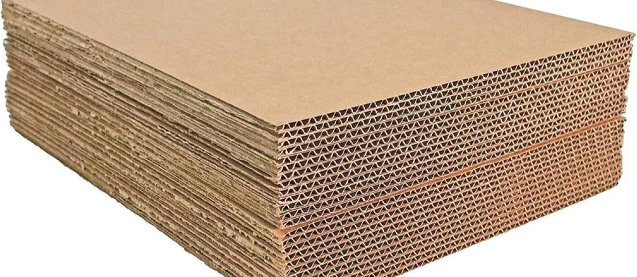 A stack of cardboard highlighting the corrugations that lend strenght to the sheets.