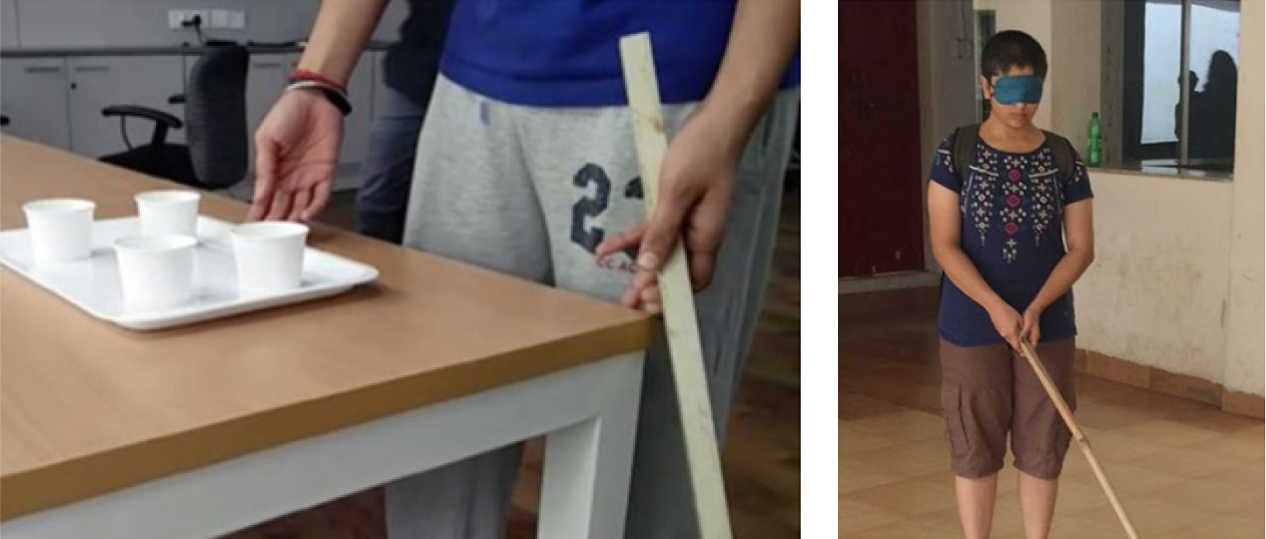 A photograph taken during the research phase to roleplay the scenario where a visually impaired person has to navigate, pick and then walk with a paper cup filled with beverage.